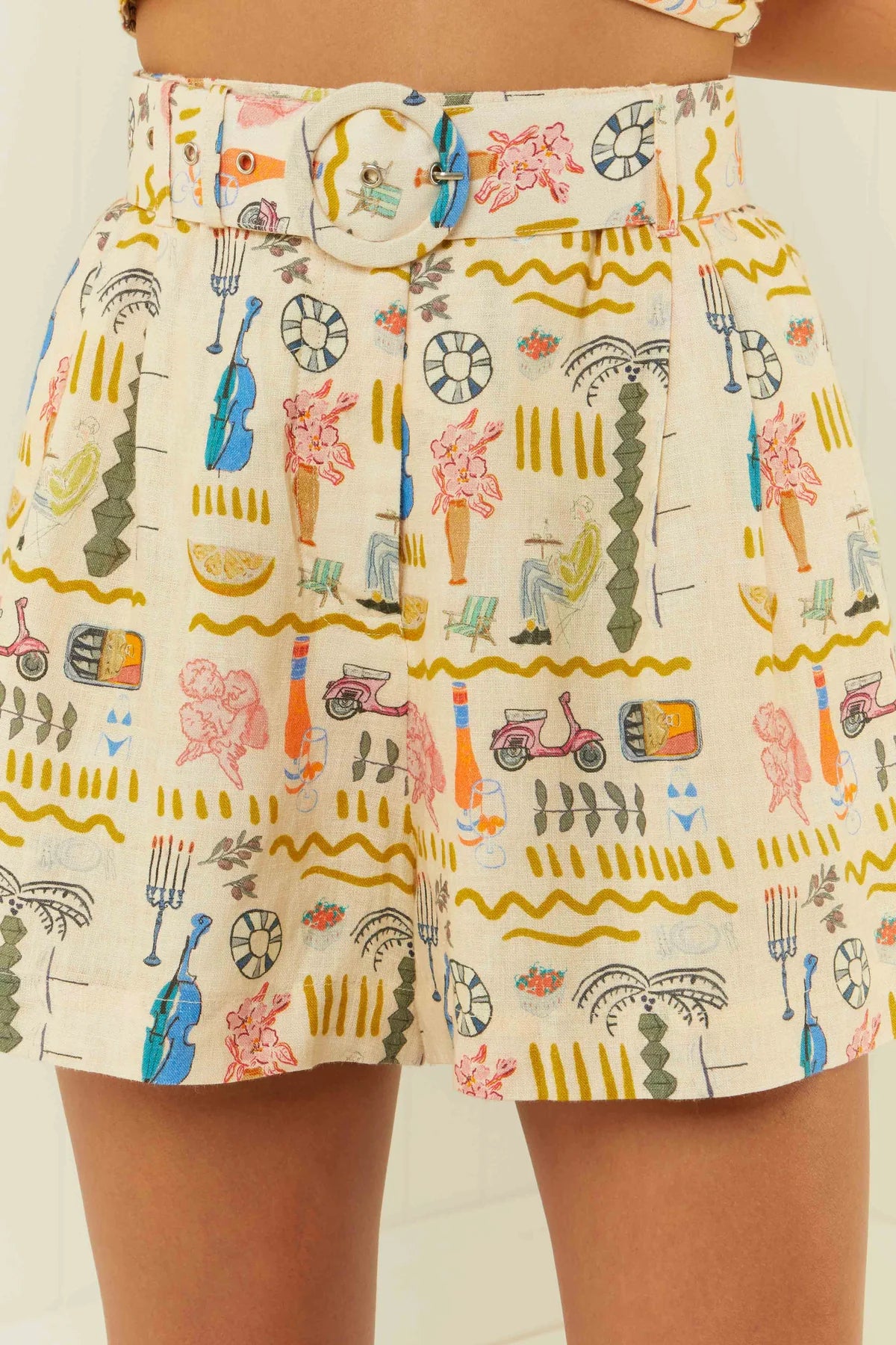 Printed linen shorts with a removable matching belt close up on model