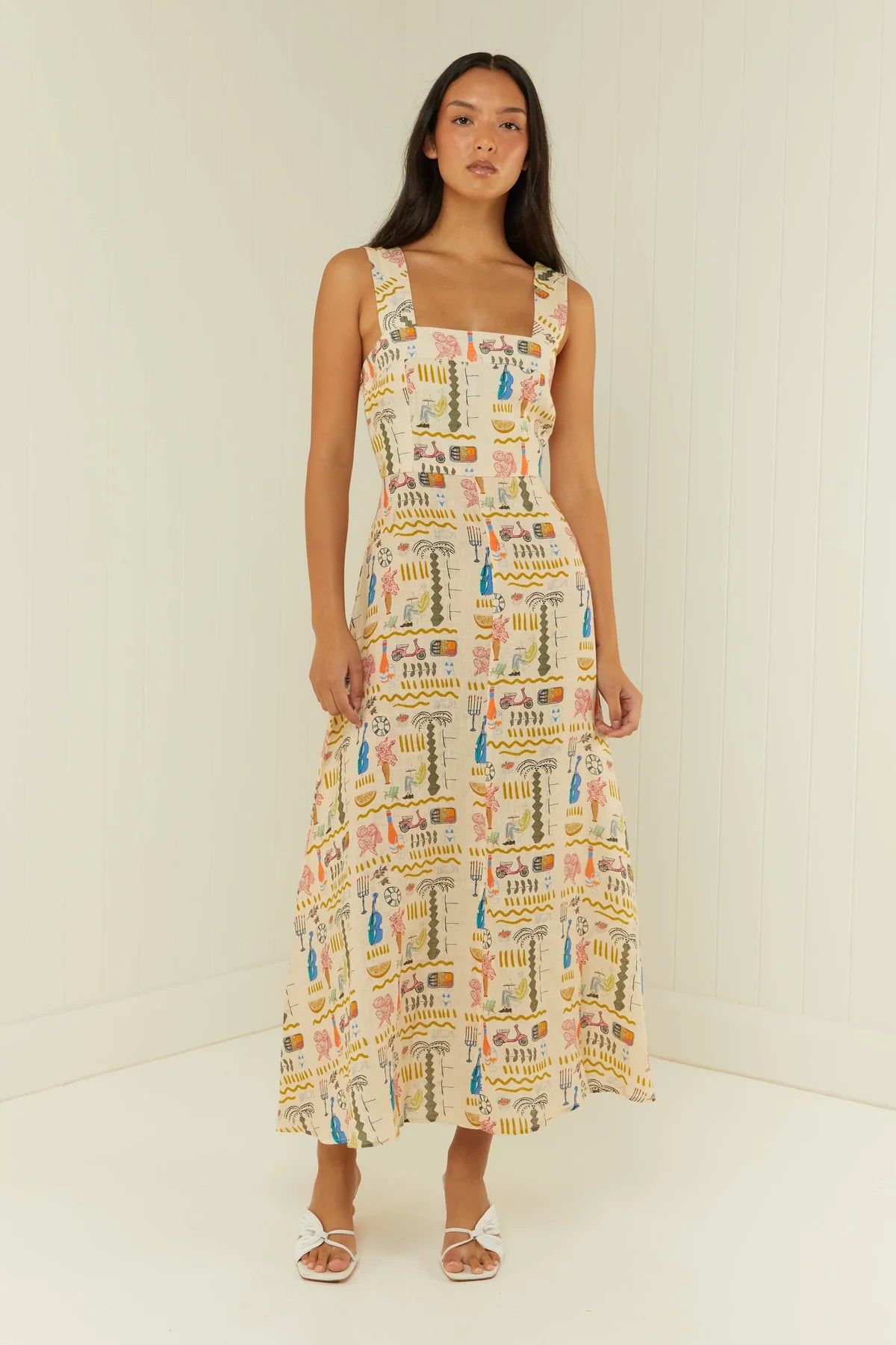 Linen summer dress in Italian inspired print with a fitted bodice and A line skirt model shot