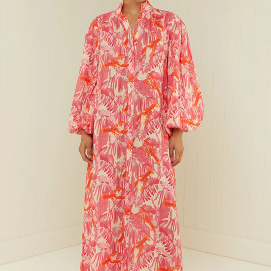 pink lobster print linen midi dress with long puff sleeves and belted waist model shot