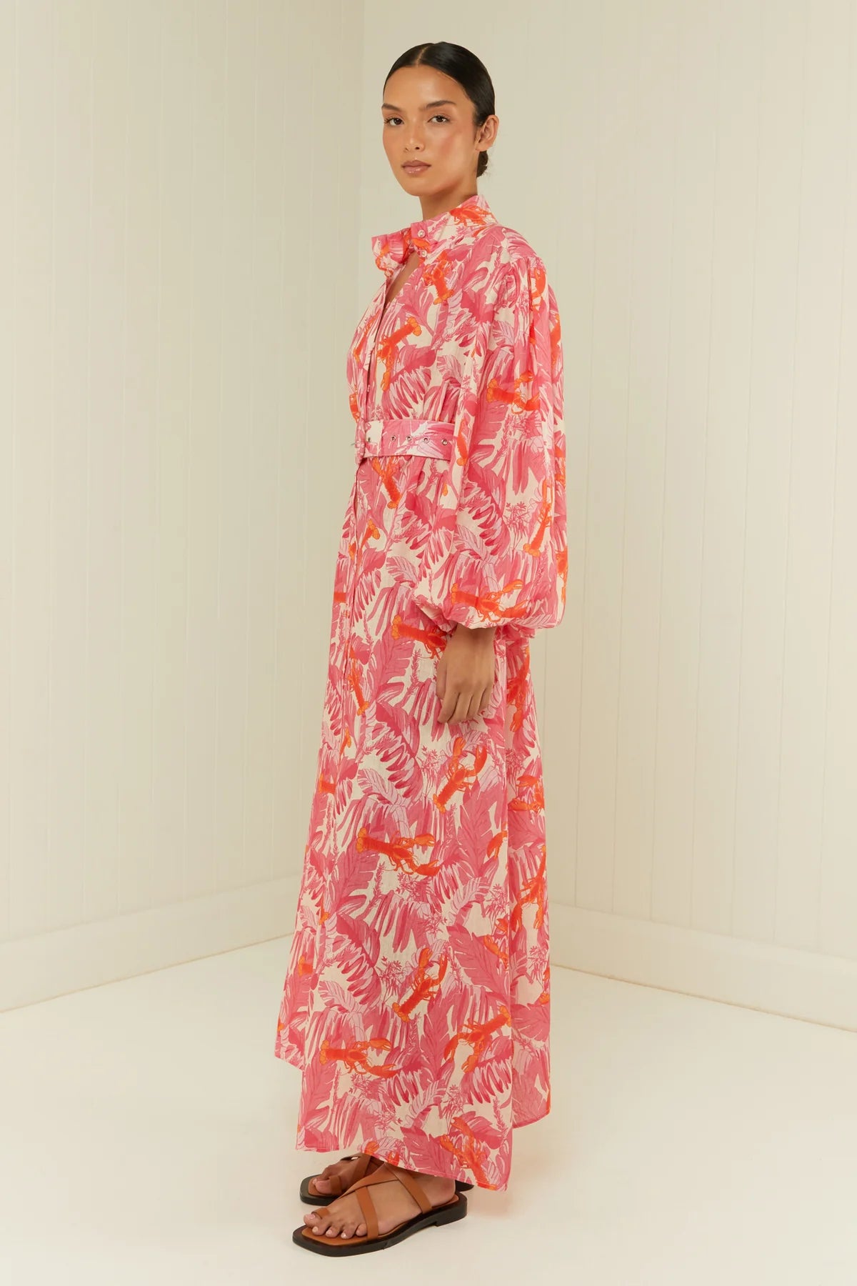 pink lobster print linen midi dress with long puff sleeves and belted waist  side view 