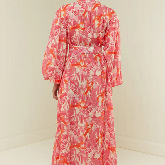 pink lobster print linen midi dress with long puff sleeves and belted waist  rear view 