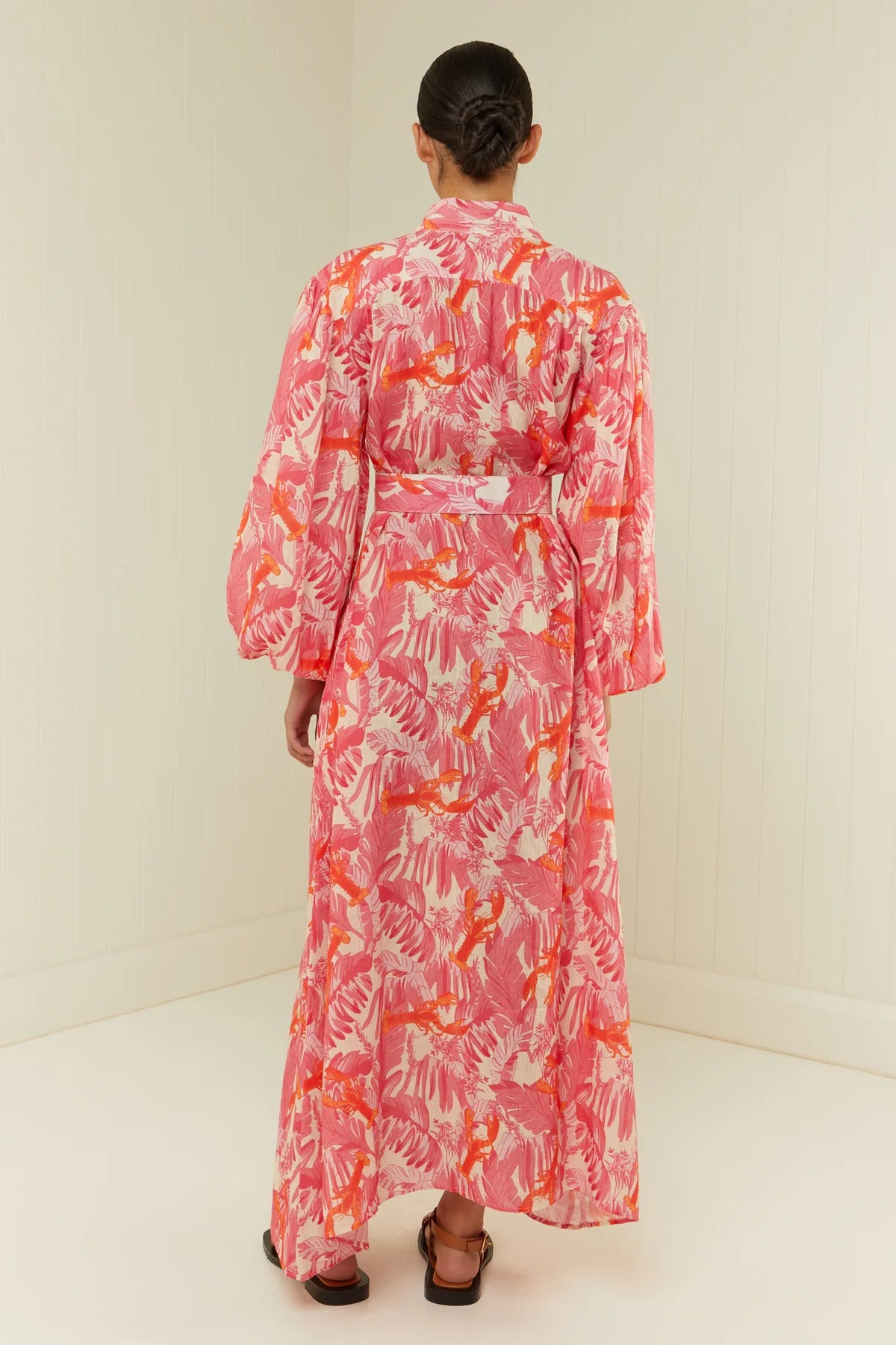 pink lobster print linen midi dress with long puff sleeves and belted waist  rear view 