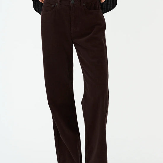 straight leg corduroy dark brown jeans with mid rise  model shot