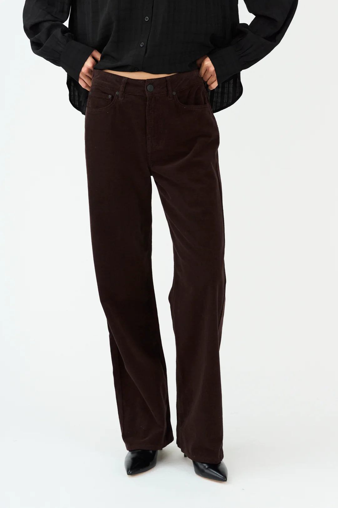 straight leg corduroy dark brown jeans with mid rise  model shot