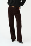 straight leg corduroy dark brown jeans with mid rise  model shot