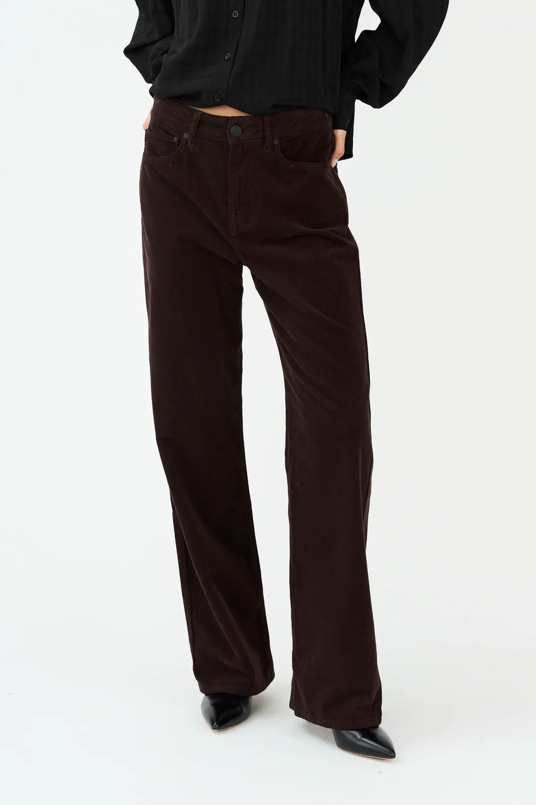 straight leg corduroy dark brown jeans with mid rise  model shot