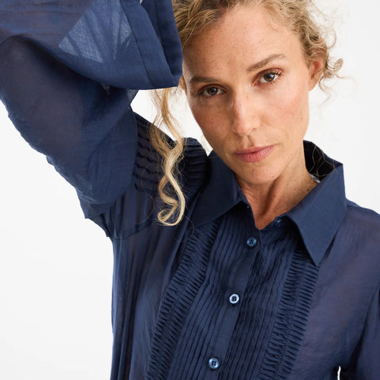 semi sheer blue pintuck shirt from pieszak close up