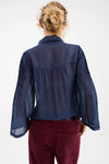 semi sheer blue pintuck shirt from pieszak rear view