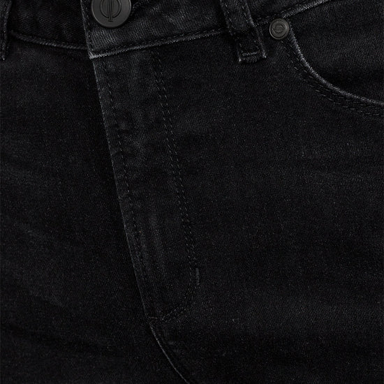 Close-up of black pants with a button and stitching detail on a white background