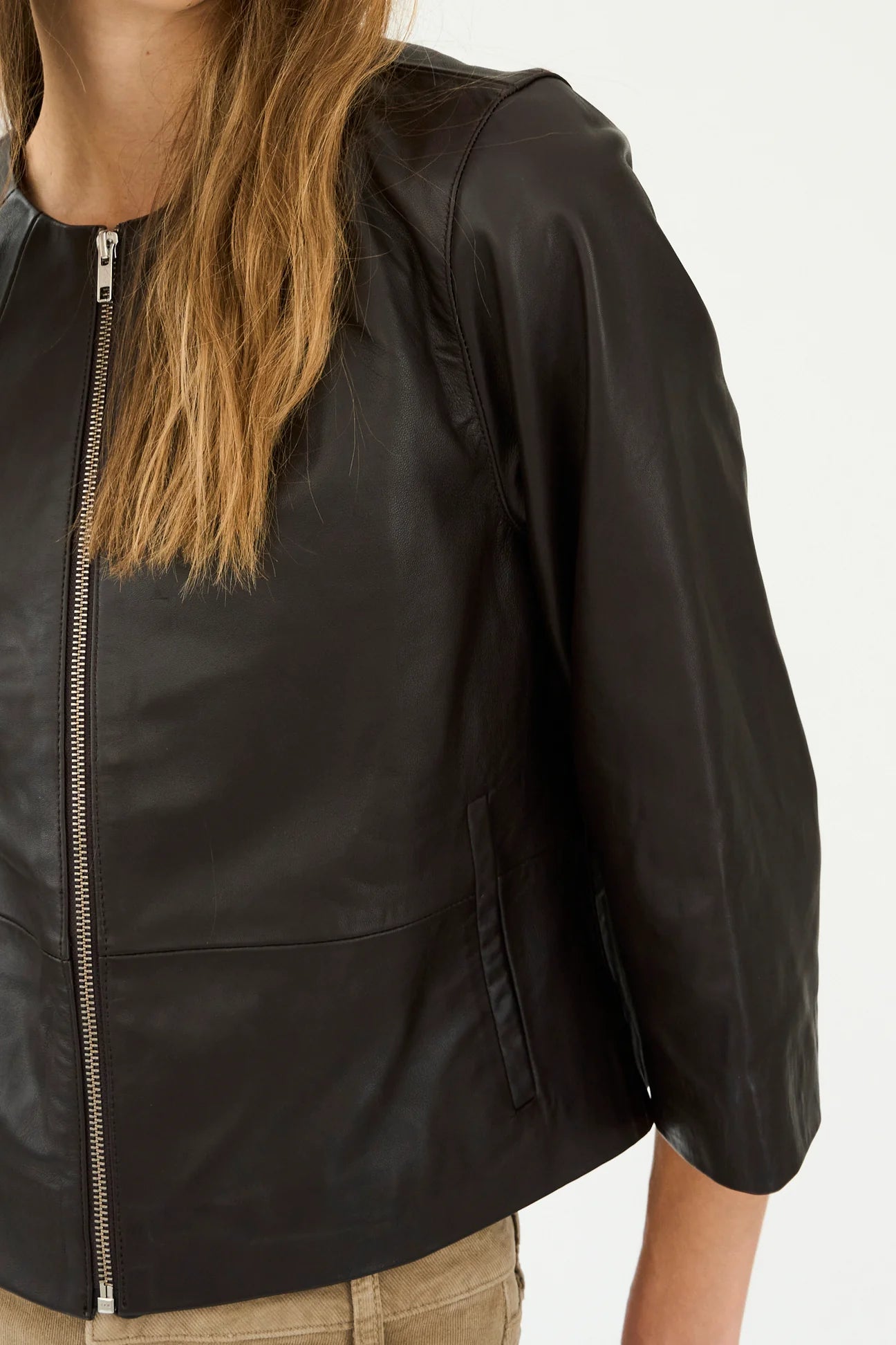 round neck dark brown leather jacket  close up