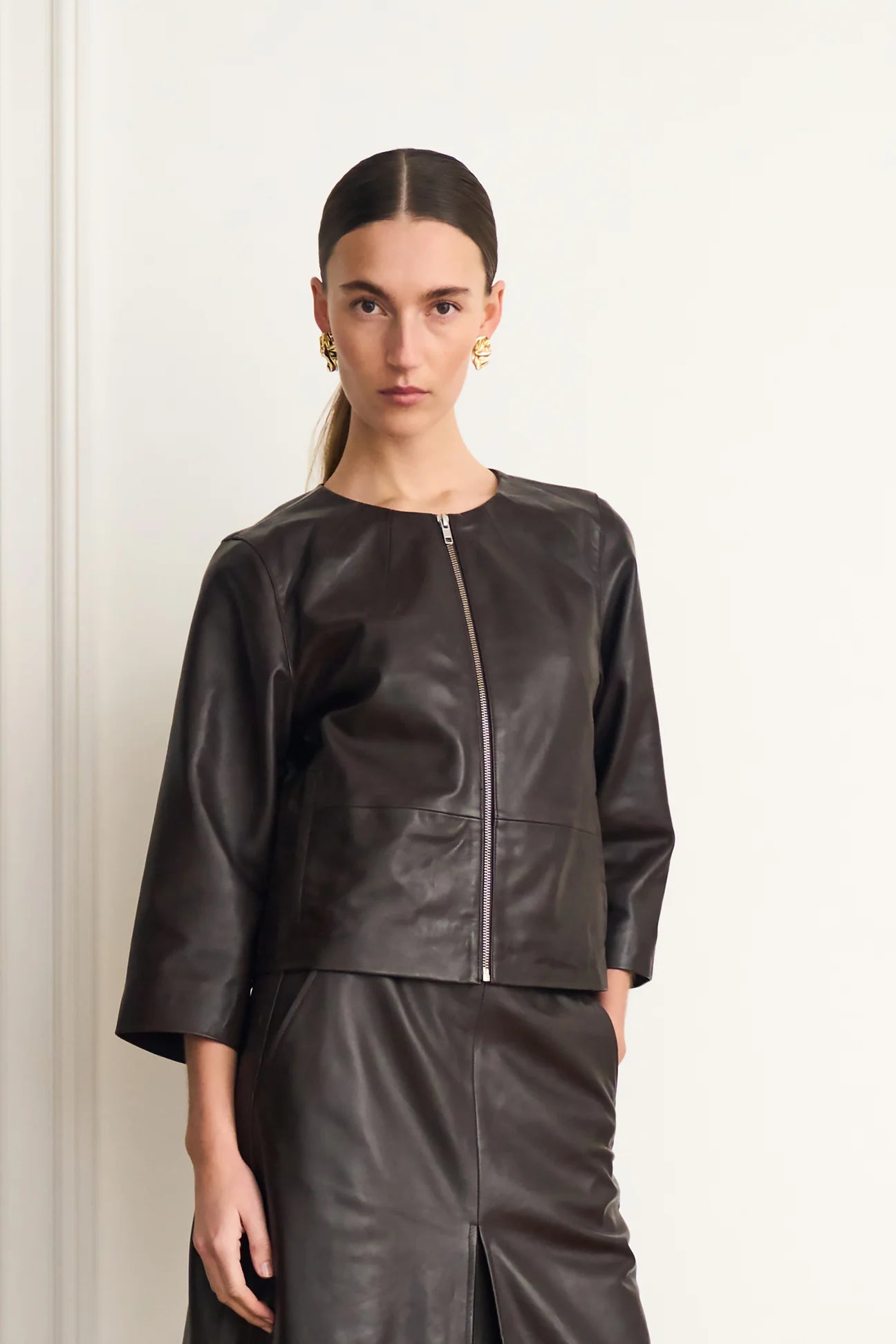 round neck dark brown leather jacket model shot