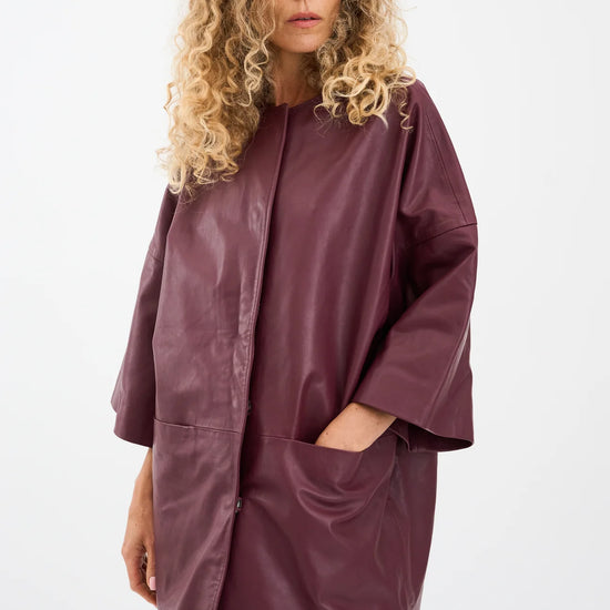 half sleeve concealed placket burgundy leather jacket from pieszak model shot