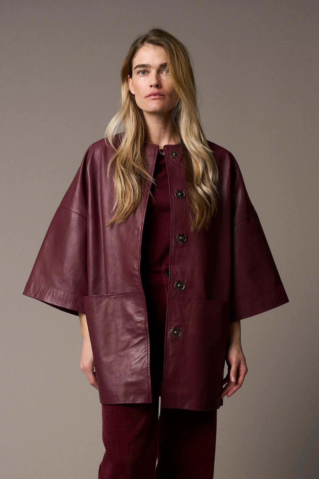 half sleeve concealed placket burgundy leather jacket from pieszak model shot