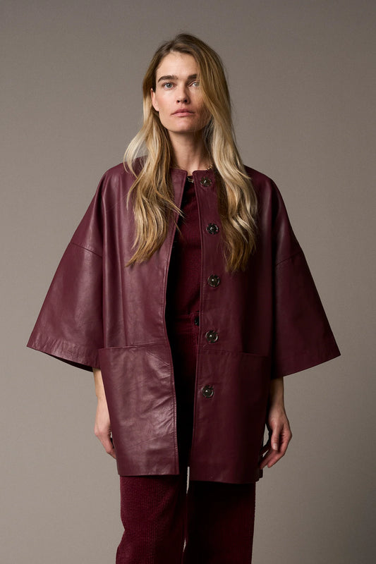 half sleeve concealed placket burgundy leather jacket from pieszak model shot