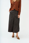 mid length chocolate brown leather pleated skirt with belt loops model shot