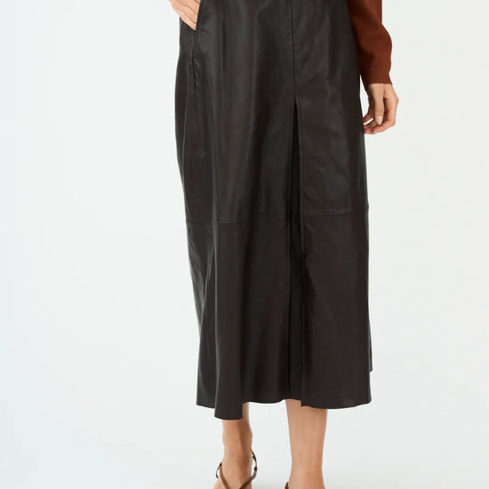 mid length chocolate brown leather pleated skirt with belt loops model shot