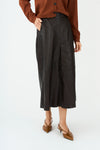mid length chocolate brown leather pleated skirt with belt loops model shot
