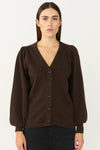 Brown puff sleeve cardigan with a v neck on a model