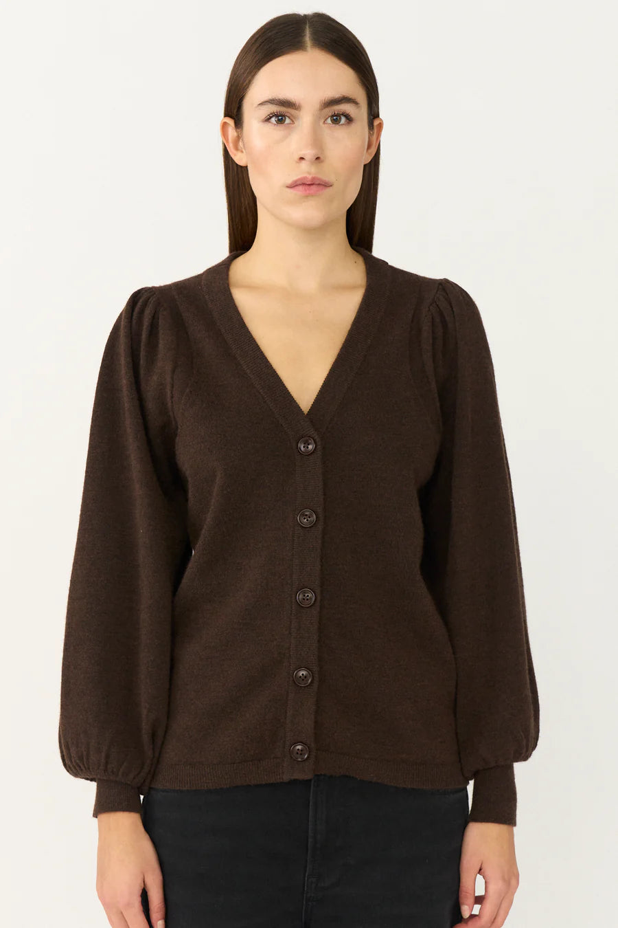 Brown puff sleeve cardigan with a v neck on a model