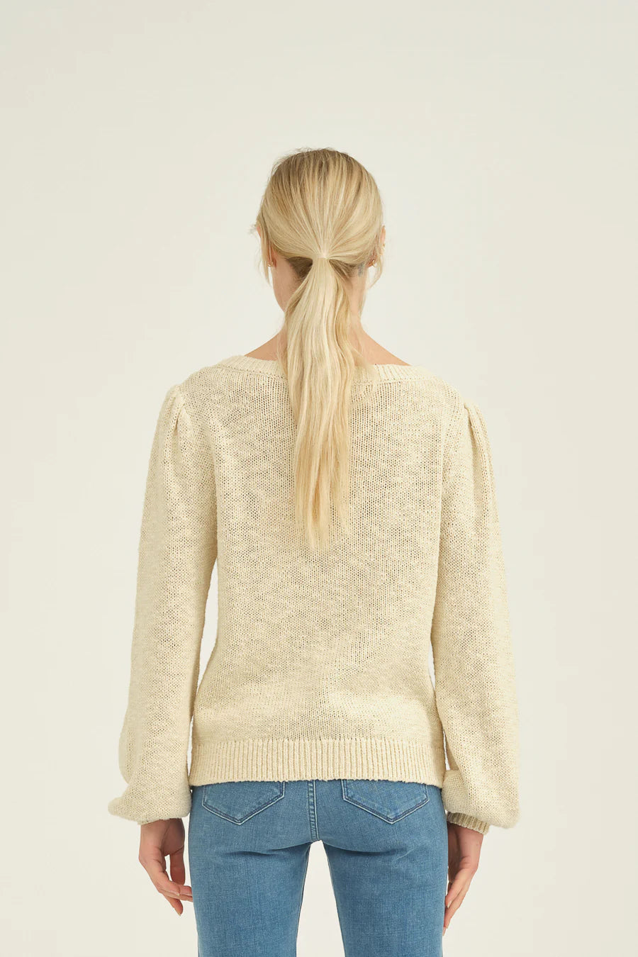 Cream cotton knitted jumper with crew neck and long sleeves with gathered shoulder seam