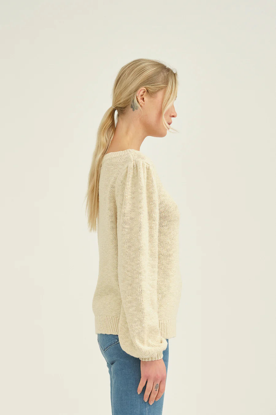 Cream cotton knitted jumper with crew neck and long sleeves with gathered shoulder seam