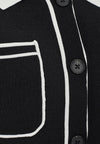 black short sleeve button through polo with white contrast details close up