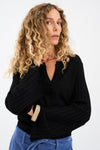 black v neck metallic top with ribbed wide sleeves from pieszak model shot