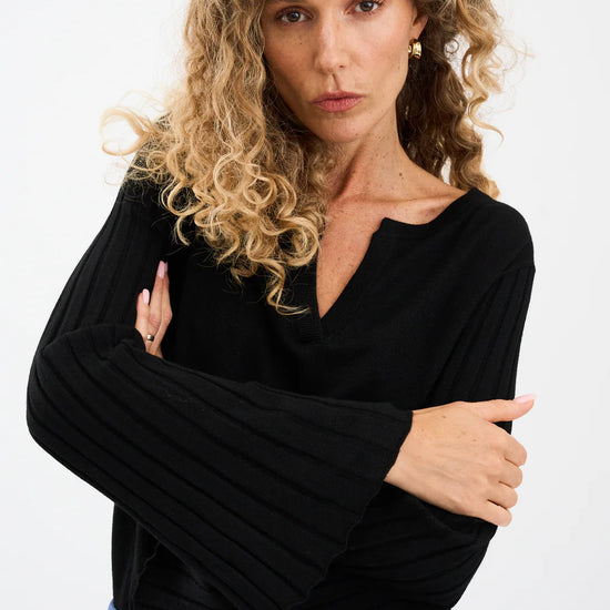 black v neck metallic top with ribbed wide sleeves from pieszak model shot