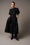 Black textured full skirt worn with matching jacket from Pieszak