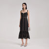 Fitted midi black cord dress with peplum hem and thick straps with bustier bodice and see-through lace lined from waist to knee