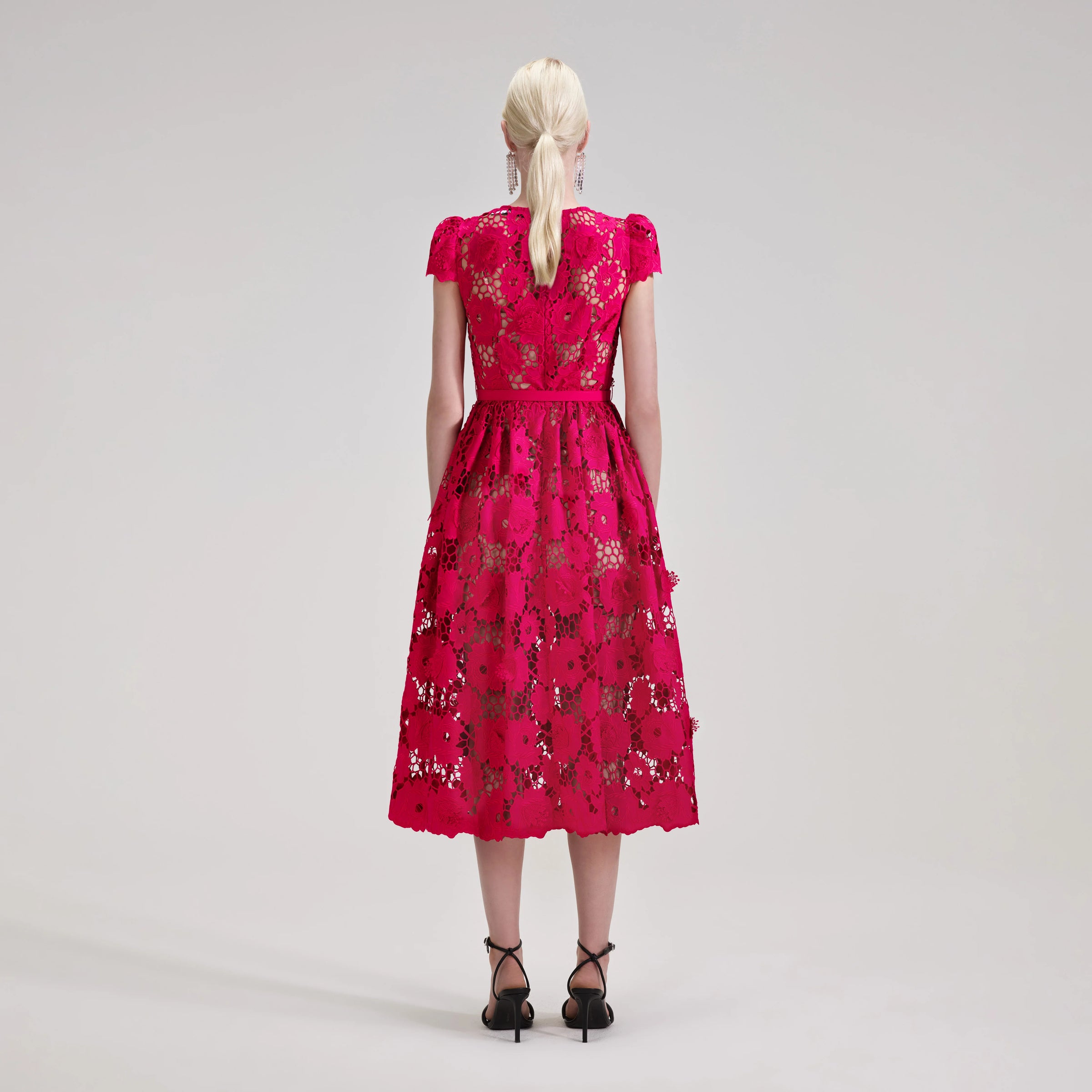 Raspberry pink lace midi dress with fitted bodice capped sleeves and tulip shaped skirt with detachable slip and fabric belt