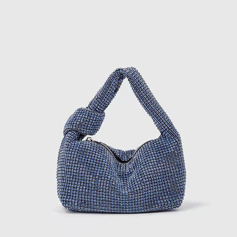 Blue coloured diamonte bag with knotted strap and zip fastening