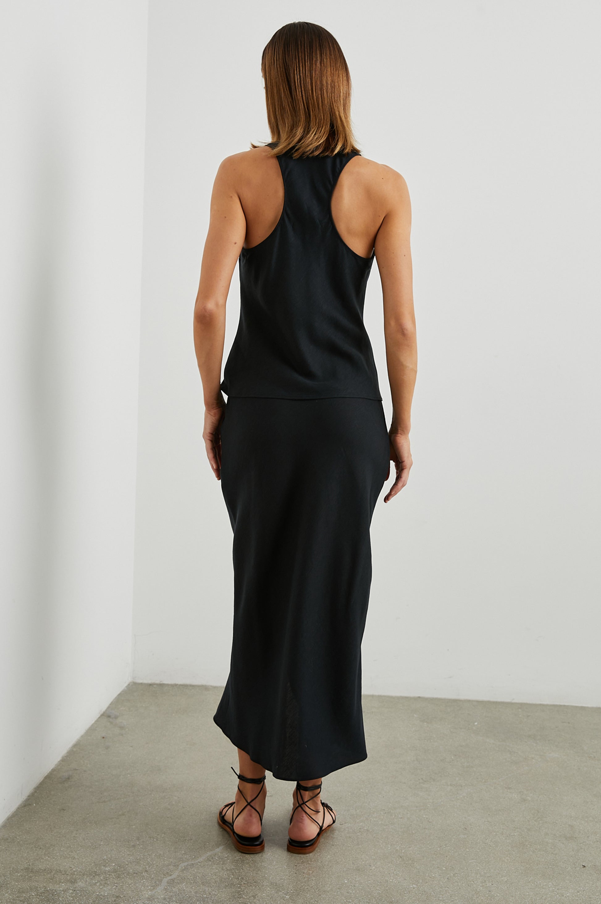 Sleeveless black top with racer back rear view