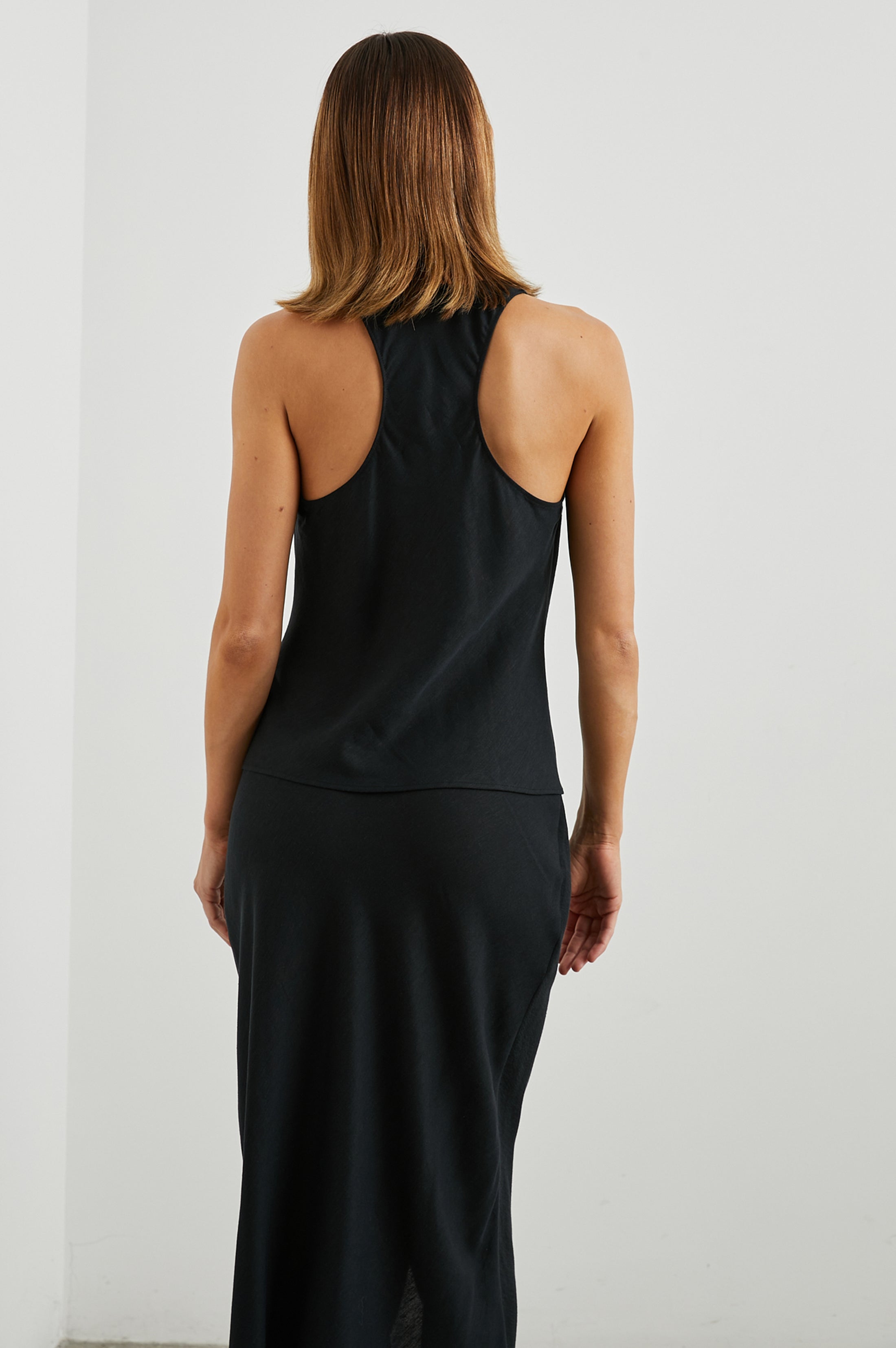 Sleeveless black top with racer back rear view