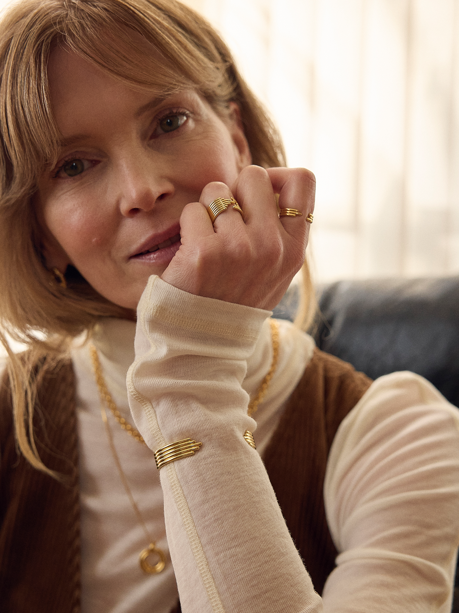 stacked gold circular bangle with different sized pieces from rachel jackson model shot