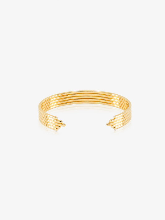 stacked gold circular bangle with different sized pieces from rachel jackson