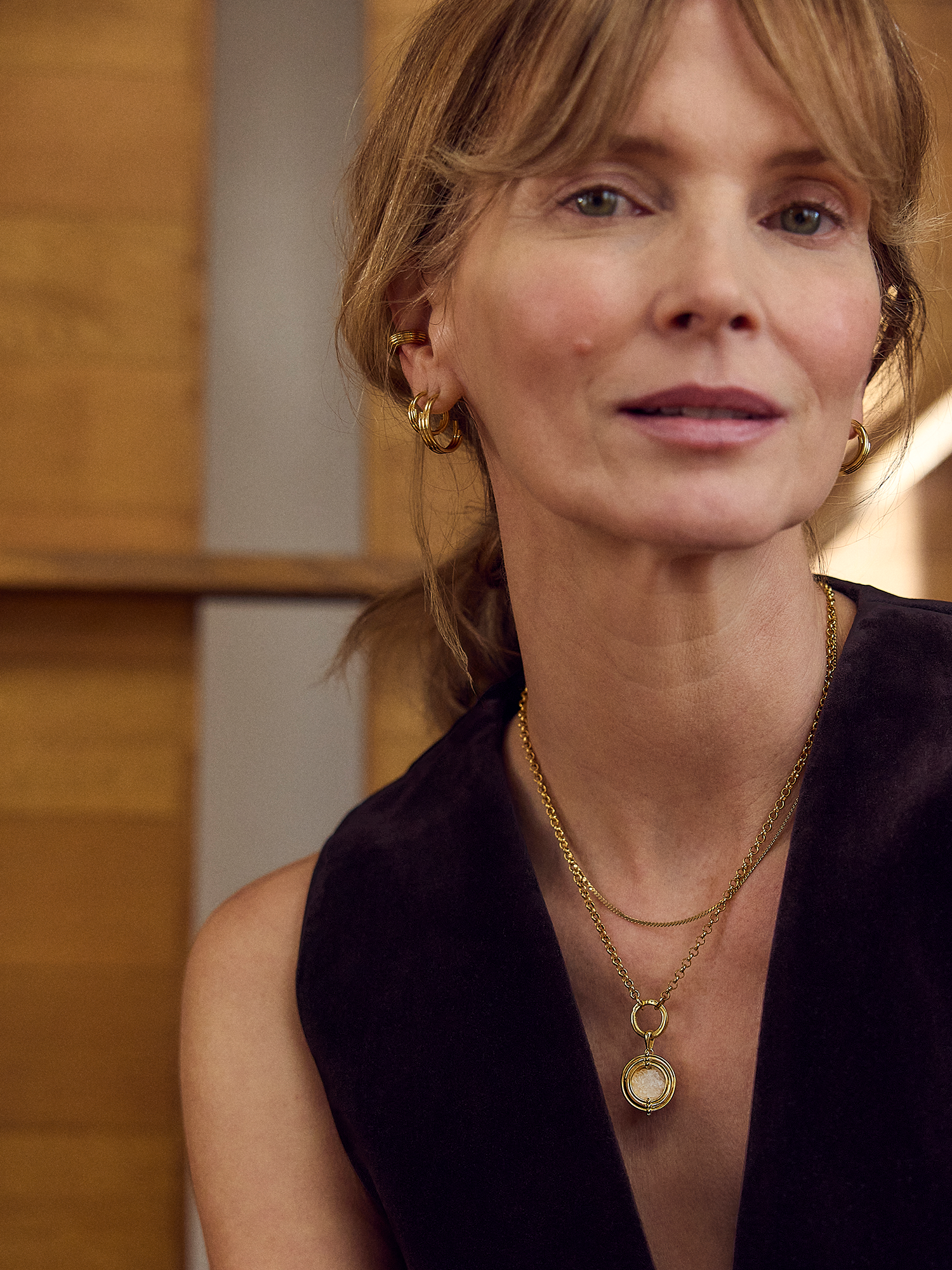 small hoop gold earrings with varying sizes rings form rachel jackson model shot