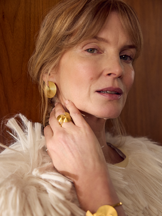 gold statement swirly circular earrings with triangle cut out form rachel jackson model shot