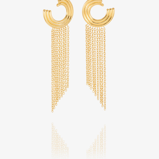 gold swirly circular hoops with chandelier style chains falling from the hoops from rachel jackson