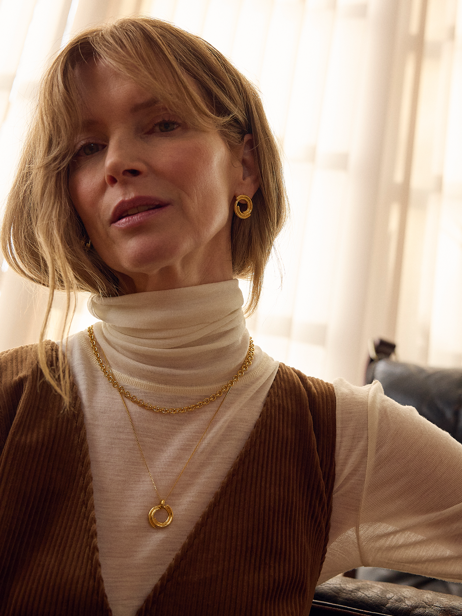 circular gold front facing earring which fit inside each other from rachel jackson model shot