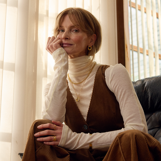 circle necklace with gold swirly effect on delicate gold chain from rachel jackson model shot