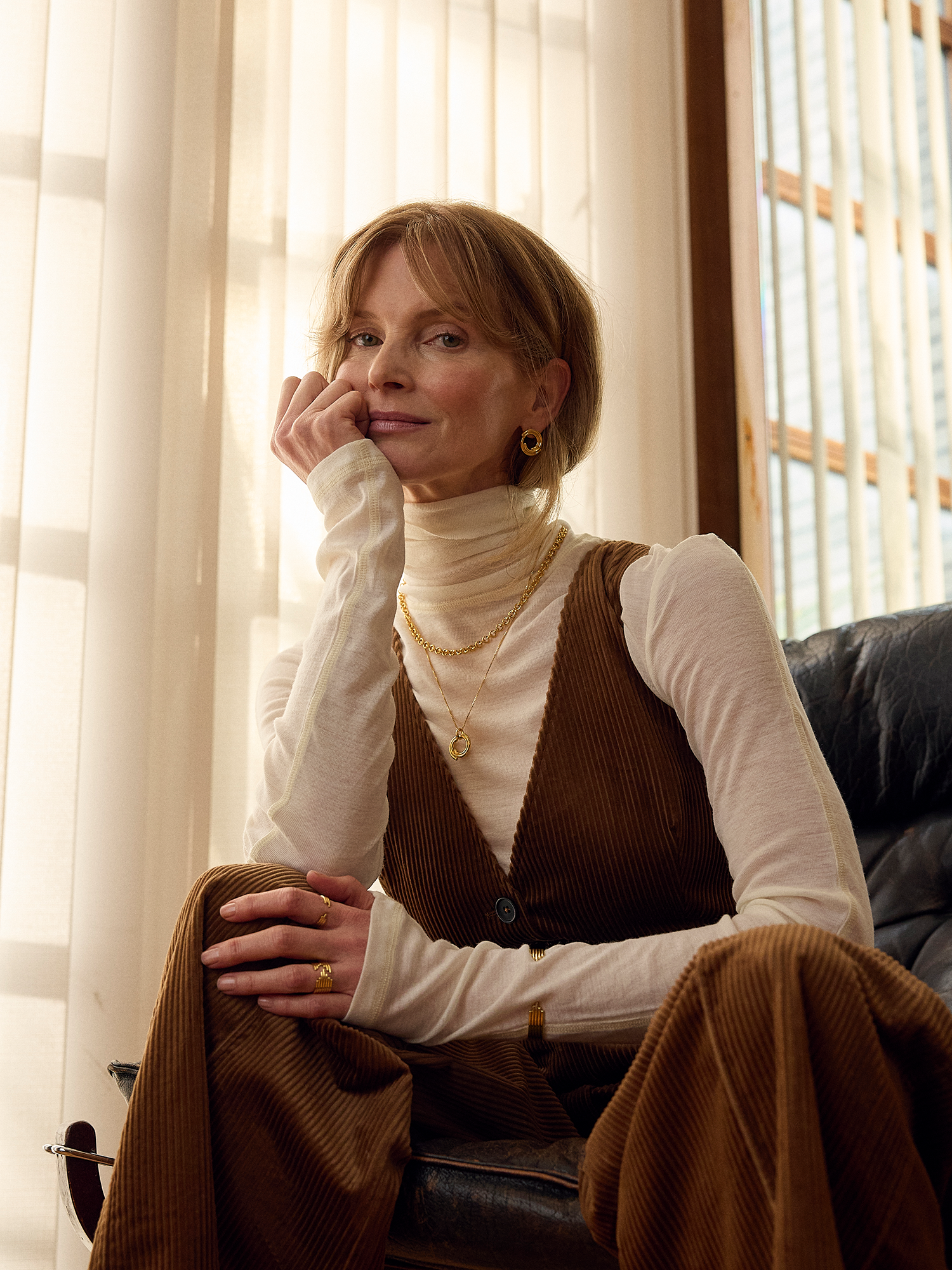 circle necklace with gold swirly effect on delicate gold chain from rachel jackson model shot