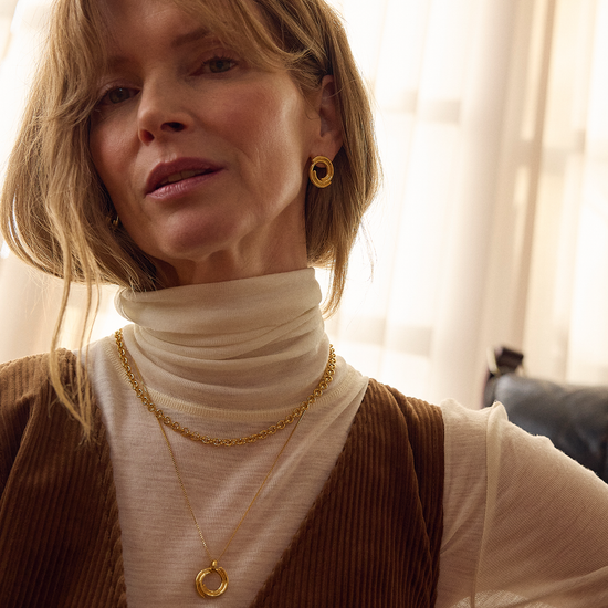 circle necklace with gold swirly effect on delicate gold chain from rachel jackson model shot