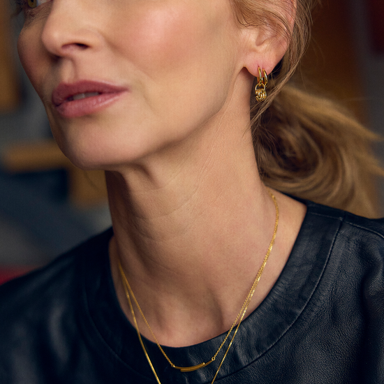 gold curve necklace with diamante detailing on a delicate gold chain from rachel jackson model shot