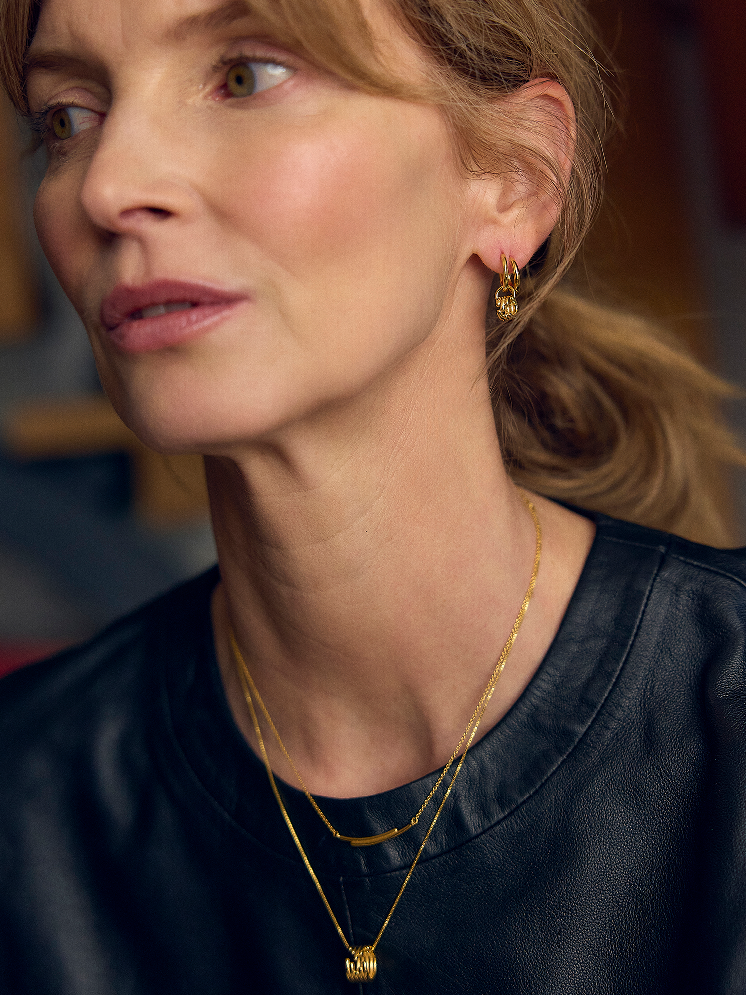 gold curve necklace with diamante detailing on a delicate gold chain from rachel jackson model shot