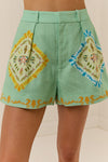 high rise wide leg green shorts with shell print on top from palm noosa model shot