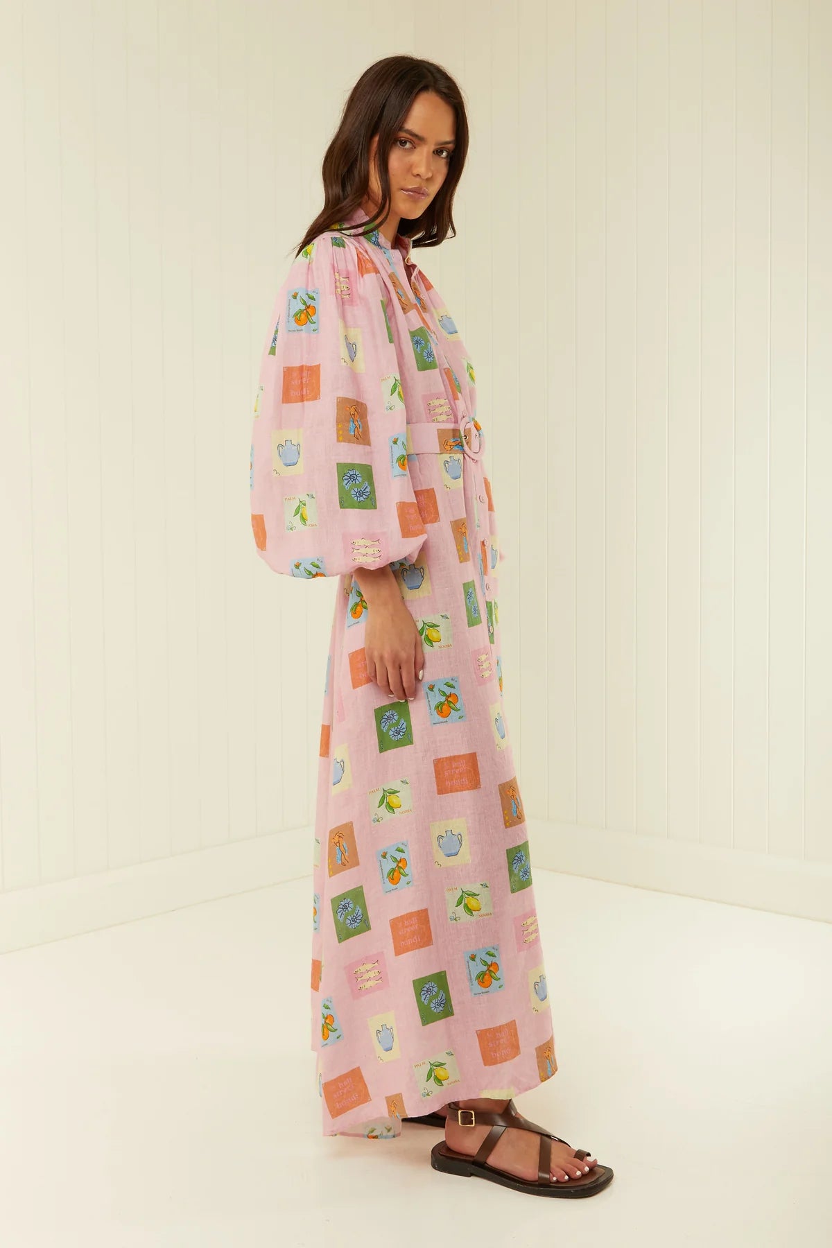 Linen button through dress with long sleeves in a pink print with a removable belt