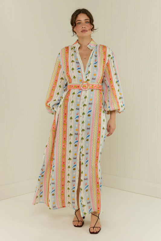  maxi length linen dress with tropical print, puffy long sleeves and belted waist  model shot