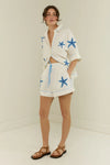 white shorts with blue starfish with elasticated drawstring waist model shot