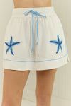 white shorts with blue starfish with elasticated drawstring waist 